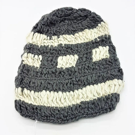 Dark gray and off-white chunky loose knit oversized beanie hat with textured crochet pattern and rectangular eye cutouts