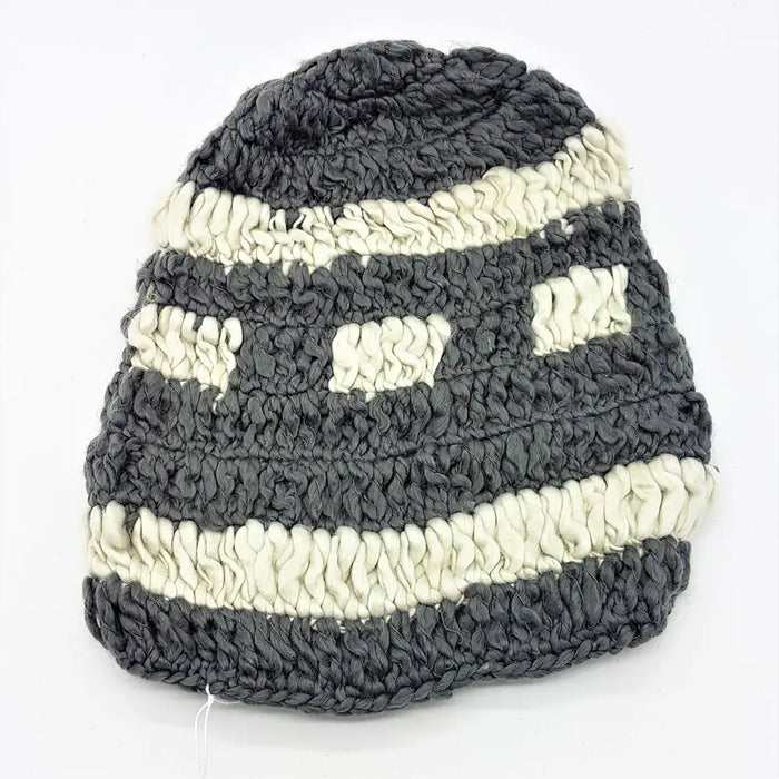 Dark gray and off-white chunky loose knit oversized beanie hat with textured crochet pattern and rectangular eye cutouts
