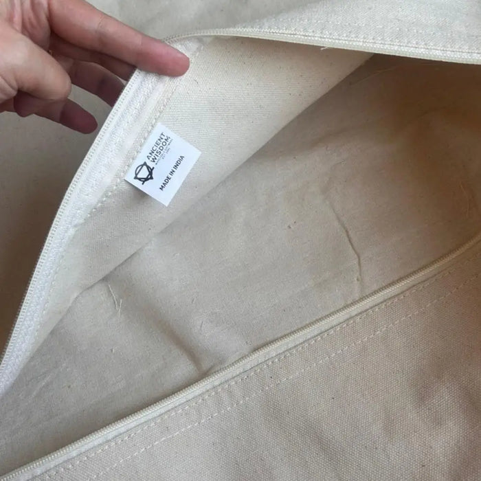 Beige canvas tote bag with white zipper and interior label shown alongside the lux comfort classic cushion cover hippie knot