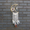Macrame dreamcatcher moon with woven web white macrame fringe and mixed feathers hanging from base