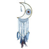 A light blue macrame dreamcatcher moon with a dark brown woven center and blue purple feathers hanging below