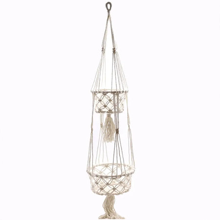 Cream-colored macrame pot holder with double tiered circular baskets made of cotton rope and decorative tassels