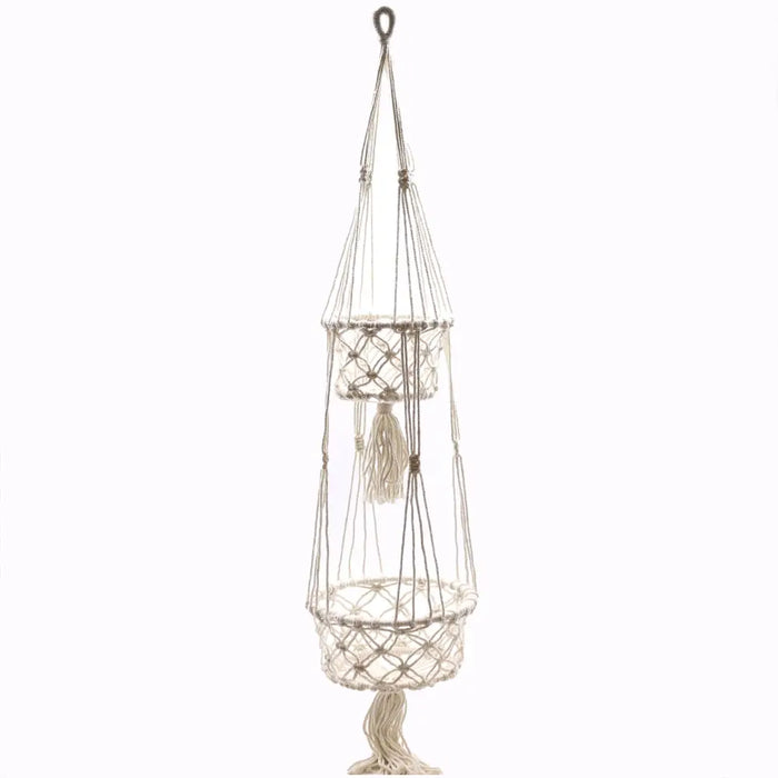 Cream-colored macrame pot holder with double tiered circular baskets made of cotton rope and decorative tassels