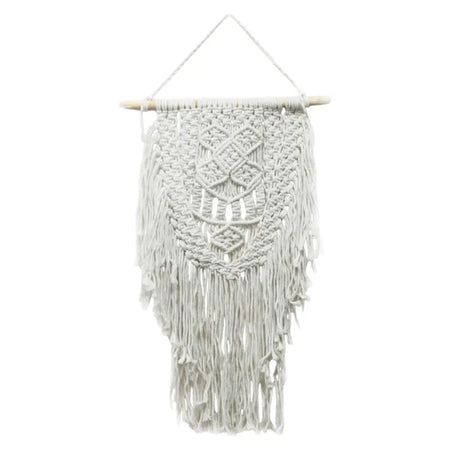 A delicate off-white macrame wall hanging with intricate geometric patterns and long flowing fringe