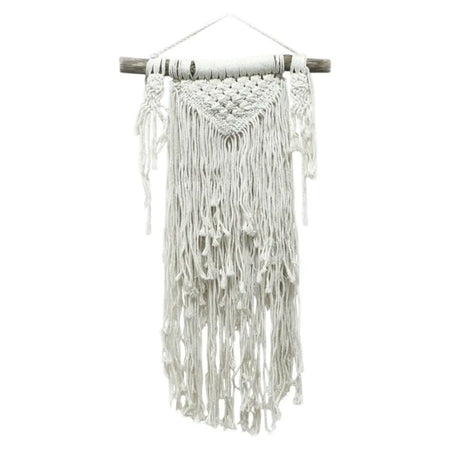White macrame wall hanging with textured woven top and long flowing fringe in natural cotton fibers