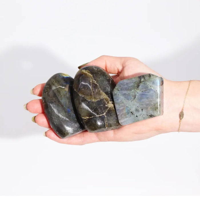 Three polished madagascar labradorite tomb stones 5-7cm with blue green iridescent sheen weighing 80-100gm each