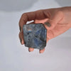 A polished square-cut madagascar labradorite tomb stone 5-7cm with blue color and silver gray iridescent flashes
