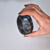 A smooth oval madagascar labradorite tomb stone with deep blue and silver iridescence 5-7cm 80-100gm