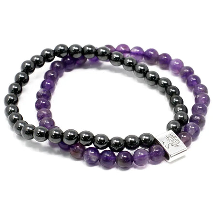 A pair of magnetic gemstone bracelets with black hematite and purple amethyst beads and a silver tree clasp