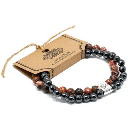 Magnetic gemstone bracelet with leopard skin jasper stones black hematite beads and a silver rectangular clasp