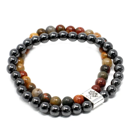 A double-strand magnetic gemstone bracelet with black hematite and earthy picasso jasper beads and a silver tree clasp