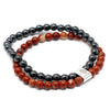 Magnetic gemstone bracelet with red and black beads and a silver tree of life clasp