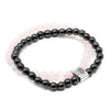 Black magnetic gemstone hematite bead bracelet with silver tree of life clasp layered over pale pink rose quartz band