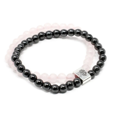 Black magnetic gemstone hematite bead bracelet with silver tree of life clasp layered over pale pink rose quartz band