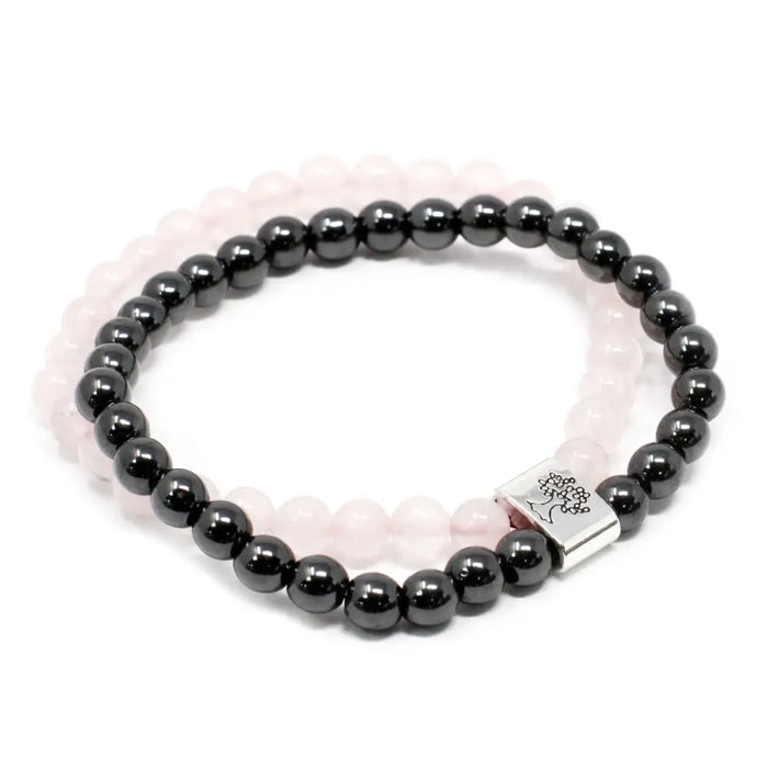 Black magnetic gemstone hematite bead bracelet with silver tree of life clasp layered over pale pink rose quartz band