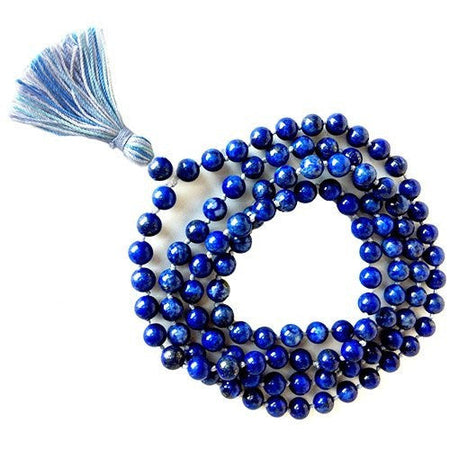 A coiled string of deep blue lapis lazuli mala beads with a matching tassel at one end