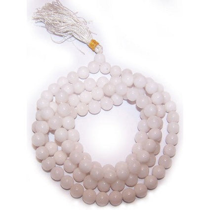 A delicate white quartz mala beads necklace with smooth spherical jade beads and a soft translucent sheen
