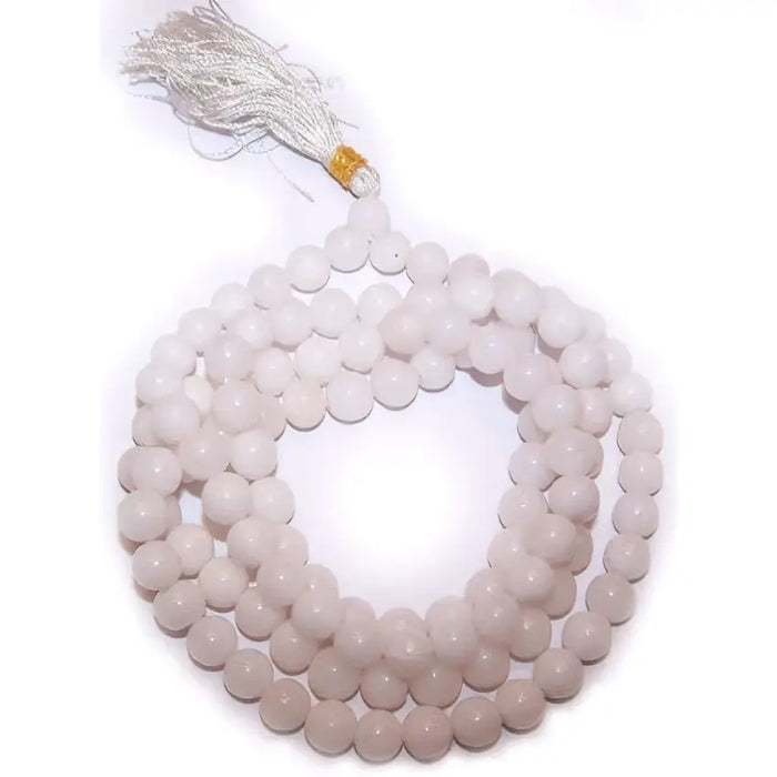 A delicate white quartz mala beads necklace with smooth spherical jade beads and a soft translucent sheen