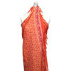 Vibrant orange tropical print mandala sarong wrap dress with fringed edges and bold purple border in pink rose tones