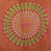 Ruby lime mandala sarong in vibrant magenta fabric with bold concentric mandala and green gold peacock feather motifs