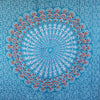 A teal orange mandala sarong with vibrant turquoise fabric featuring intricate red white and blue paisley patterns
