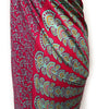 A vibrant red mandala sarong with teal purple paisley and floral patterns made from lightweight fabric