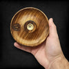 Hand carved mango wood incense burner with natural grain finish om symbol and brass colored circular opening