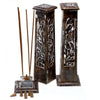 Two dark brown mango wood incense towers with tapered square tops and carved floral patterns in whitewash finish