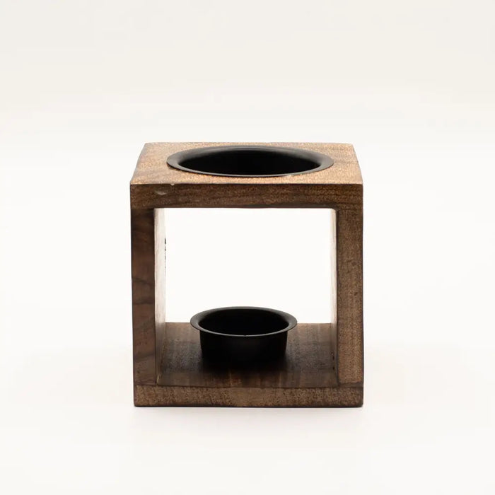 Brown mango wood oil burner shaped like a cube with a black circular top and smaller black cup at the bottom