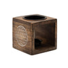 Dark brown mango wood oil burner cube with carved white flower of life design and two black ceramic holders