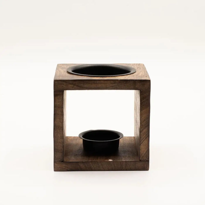 Dark wood mango wood oil burner in cube shape with yin yang black circular compartments on top and bottom