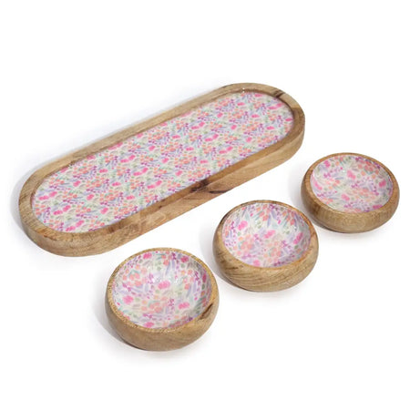 Mango wood tray with three bowls featuring a pink and purple floral pattern inside on a light wood background