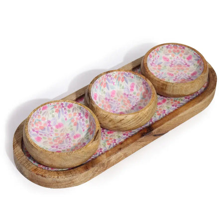 Set of three mango wood bowls with floral patterned interiors in a matching mango wood tray