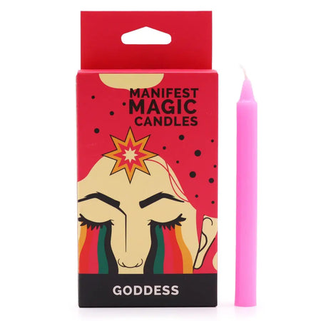 A vibrant pink cylindrical wax candle next to red and black packaging showing a goddess illustration and manifest magic candles