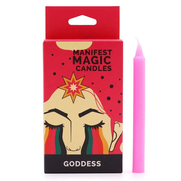 A vibrant pink cylindrical wax candle next to red and black packaging showing a goddess illustration and manifest magic candles
