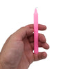 A slender solid pink wax candle with a smooth surface and tapered top from manifest magic candles goddess pink line
