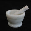 Medium white marble mortar and pestle set made of smooth stone for grinding and crushing ingredients