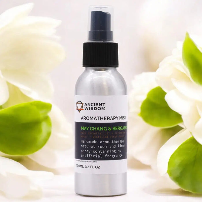 A sleek silver spray bottle with black nozzle labeled ancient wisdom aromatherapy mist with bergamot and chang essential oil