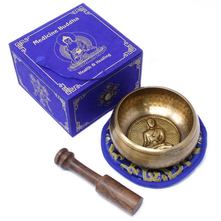 Golden brass medicine buddha singing bowl set 10cm with detailed seated buddha embossed inside for meditation use