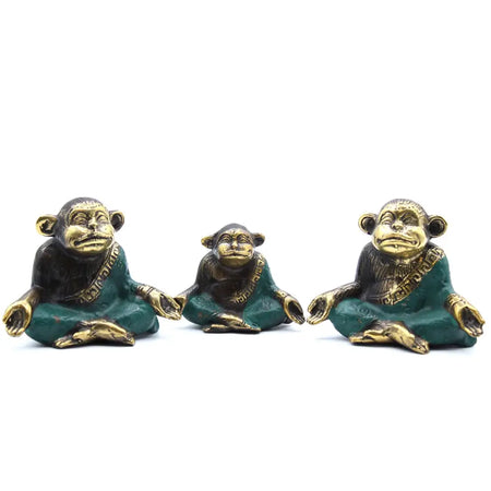 Three brass monkeys seated in meditation wearing teal green robes with gold trimming meditating brass monkeys set of three