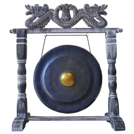 Medium black 35cm gong with dark blue bronze and golden center mounted on a wooden stand with carved dragon motifs