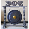 Medium black gong with golden center on a carved wooden stand featuring dragon heads 50cm diameter