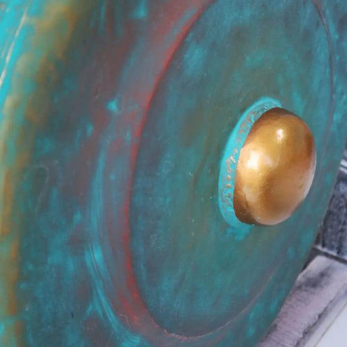 Medium bronze gong with turquoise patina and golden boss on a stand with green wash finish 35cm