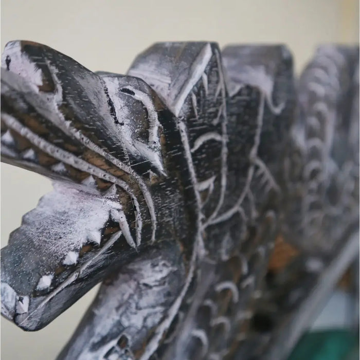 Medium gong on stand with a dark wood dragon head carved and white painted details on scales and teeth