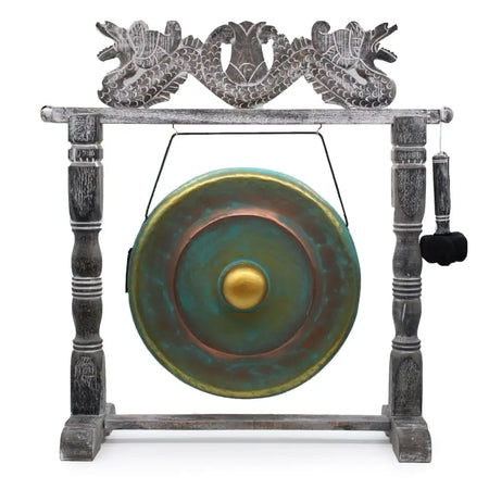 Medium 50cm bronze gong with verdigris patina and golden center on a carved wooden dragon stand with green wash finish