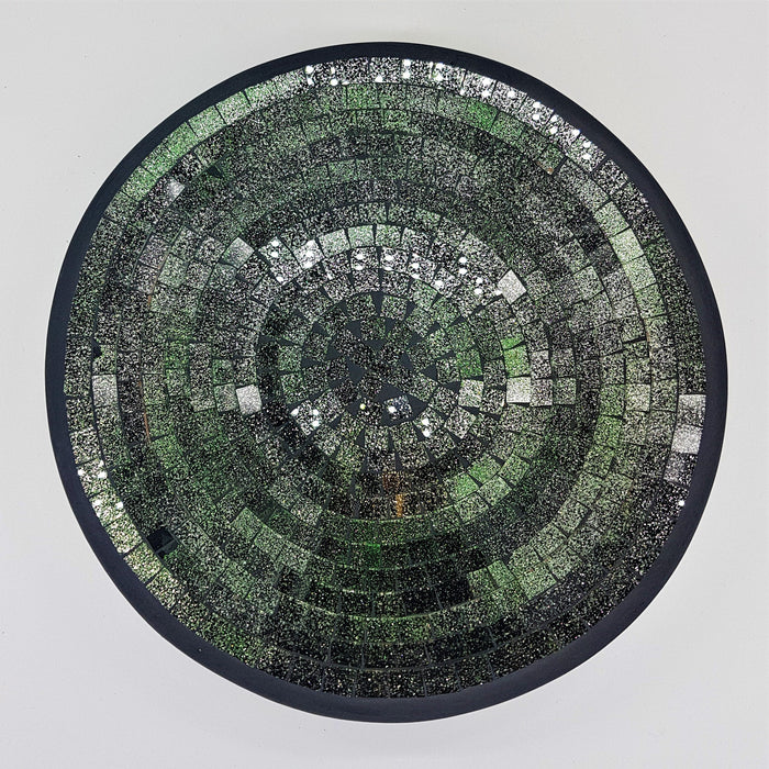Medium mosaic tile dish with green and silver reflective tiles in concentric circles and a dark border