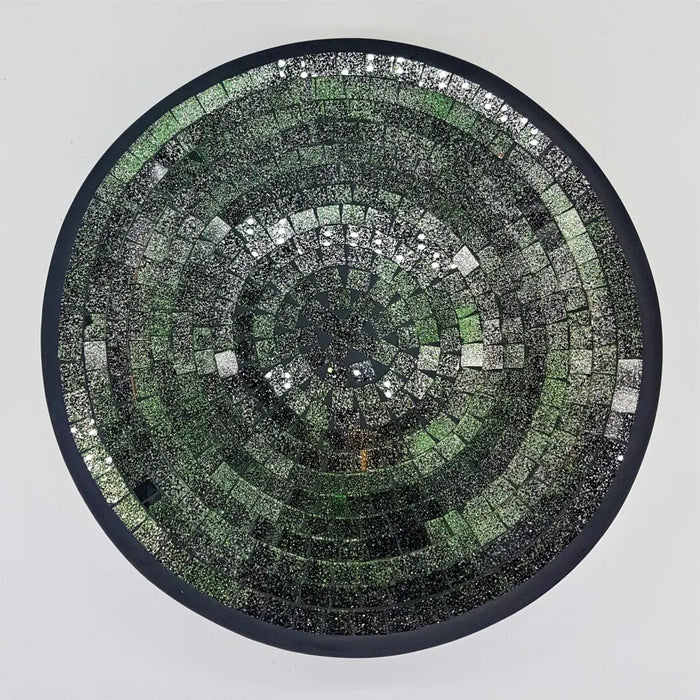 Medium mosaic tile dish with green and silver reflective tiles in concentric circles and a dark border