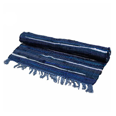 A rolled-up dark blue and white striped woven rag rug with frayed edges made from cotton fibers
