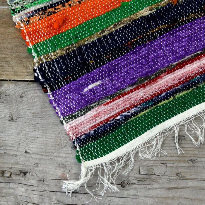 Medium rag rug natural showing vibrant multicolored woven rag rugs with orange green purple red navy and white stripes
