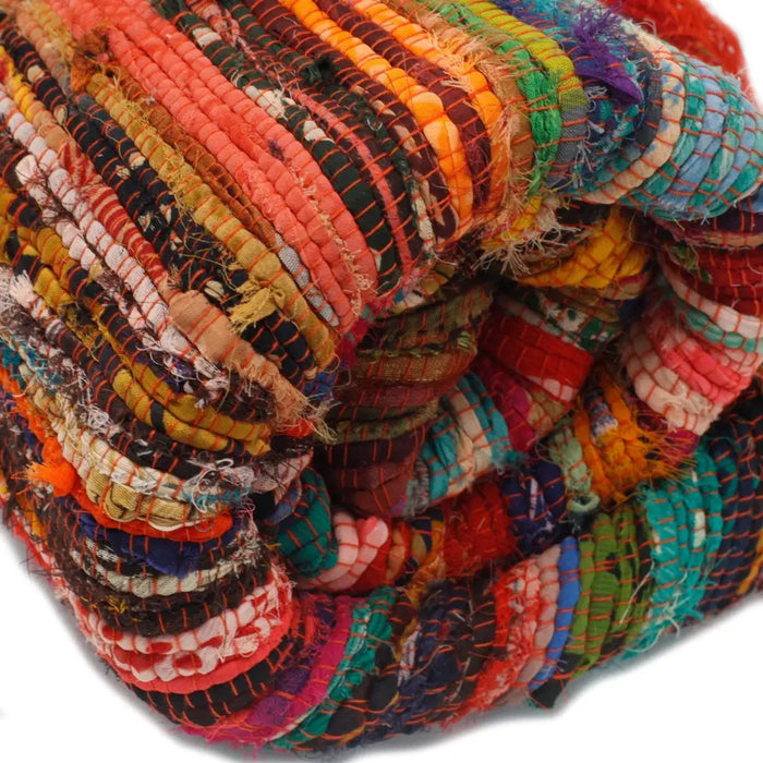 Medium rag rug orange made from vibrant multicolored fabric strips woven into a handcrafted patchwork rag rug design